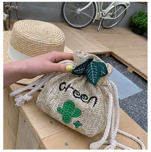Cute straw woven bucket bag with cactus embroidery and drawstring design for daily use.