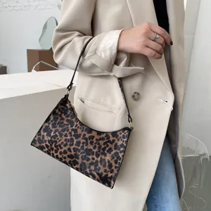 Detailed view of the trendy leopard print women shoulder bag, retro niche design mini baguette.