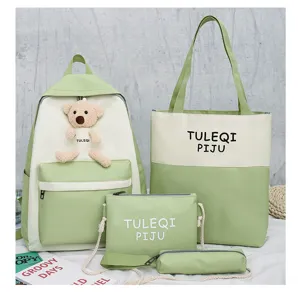 Detailed view of the 4-piece student canvas backpack set in cute light green and white.