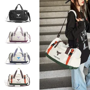 Detailed view of the large capacity sports duffel bag with multi-color options and straps.