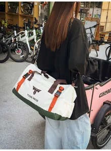 Detailed view of the large capacity travel duffel bag with stylish straps for outdoor fitness.