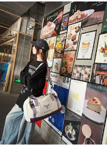 Large capacity sports duffel bag for travel, fitness and outdoor use with shoulder strap.