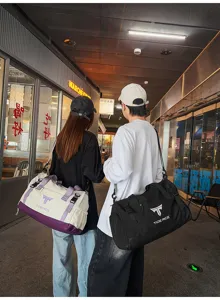 Detailed lifestyle scene showing large capacity duffel bags worn outdoors during travel.