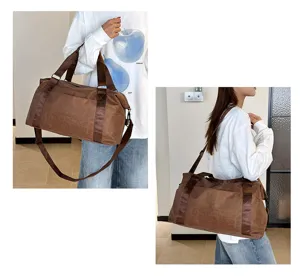 Detail view of the brown leopard print travel duffel bag showing durable straps and large capacity.