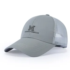 Close-up detail of gray mesh baseball cap with front embroidered letter text design.