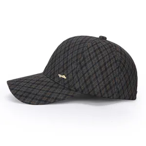 Stylish plaid winter baseball cap for women, warm outdoor snapback hat with metallic accent.