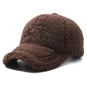 Close-up detail of the brown sherpa fleece baseball cap texture and fuzzy fabric for autumn.