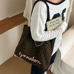 Casual leopard print tote bag with pink embroidery, large capacity daily shoulder bag detail.