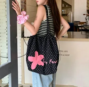 Korean style black polka dot canvas shoulder tote bag with cute pink flower embroidery detail.