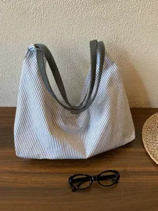 Casual striped canvas hobo shoulder bag, lightweight large capacity tote for women daily use.