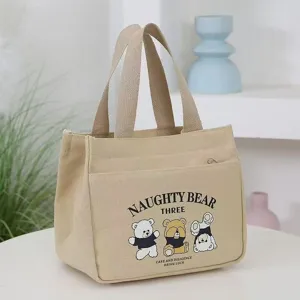 Close-up detail of the canvas lunch handbag featuring cute bear print and sturdy dual handles.
