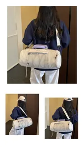 Large capacity cylindrical fitness duffel bag with wet dry separation and mesh pocket for travel.