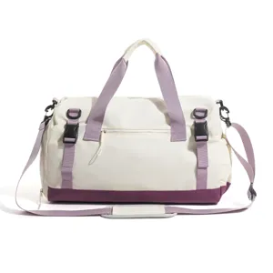 Large capacity travel duffel bag with purple straps for fitness, sports and outdoor weekend trips.