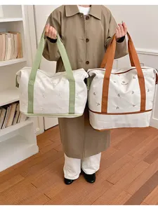 Large capacity canvas travel bag stylish hand luggage tote for women short trips fitness.