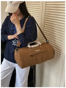 Large capacity brown sports gym duffel bag for travel, yoga, and fitness use with wet dry separation.