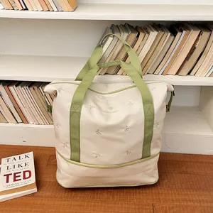 Large capacity canvas travel tote bag with green straps and cute bow embroidery designs.