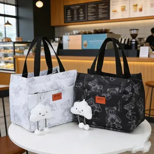 Fashion canvas lunch bag with cute bear pattern and plush cloud pendant, durable daily bento tote.