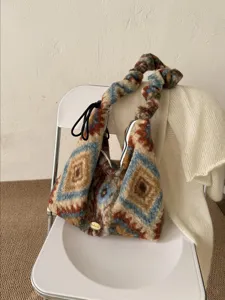 Vintage ethnic diamond plush tote bag, cozy winter shoulder bag with drawstring detail.