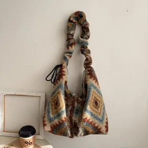 Ethnic geometric pattern plush tote bag for women, cozy winter shoulder bag with scrunchie strap.