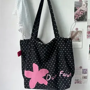 Korean style polka dot canvas shoulder tote bag with cute flower embroidery and letter design.