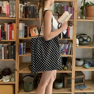 Classic black and white polka dot canvas tote bag, stylish shoulder bag for daily commute.