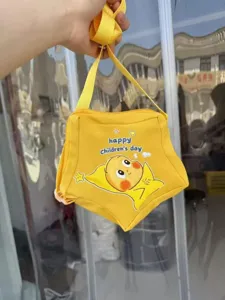 Cute star-shaped children's day crossbody bag in bright yellow with funny cartoon print.