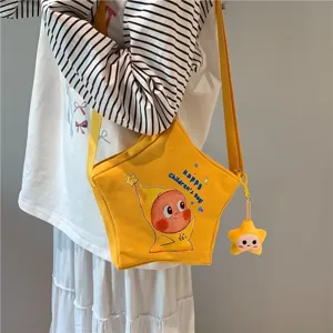 Cute yellow star crossbody bag with cute cartoon print and plush pendant, casual canvas bag.