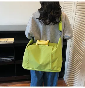 Large capacity expandable travel gym bag with shoulder strap for sports and short trips.