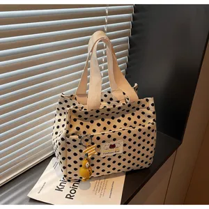 Canvas lunch tote bag with cute polka dot pattern, minimalist design for daily commuting and office work.