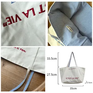 Canvas tote bag with embroidered letter design, large capacity casual shoulder bag for women.
