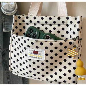 Canvas tote bag with cute polka dots, front zipper pocket and stylish pendants for daily use.