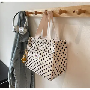 Detail view of a cute polka dot canvas tote bag, perfect daily lunch bag or casual handbag.