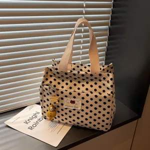 Casual black and white polka dot canvas tote bag with front pocket, student handbag