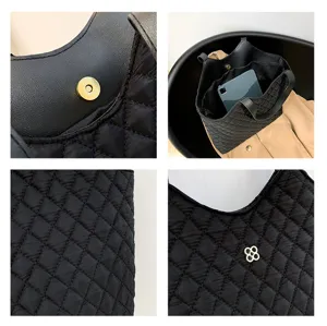 Black quilted oxford cloth tote bag detail, featuring durable stitching, spacious interior.