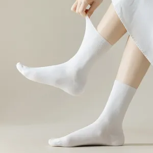 Discover comfortable pure white mid-tube cotton socks for women, perfect for spring and summer.