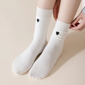 Women cotton mid-calf socks with cute black embroidered heart for autumn winter daily wear.