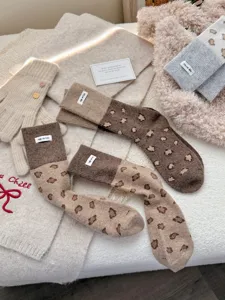Cozy winter leopard print knit socks with cute cloth labels, thick warm wool mid-calf socks for women.