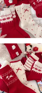 Thick warm wool winter long socks for women with festive red and white knit design.
