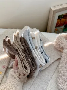 Cozy wool winter mid-calf socks with cute animal print, soft knit retro thermal socks for women.