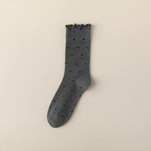 Women's grey cotton mid-tube socks with cute ruffled cuffs and classic black polka dot pattern.