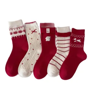 Thickened warm red wool winter socks set for women, festive Christmas and New Year long hosiery.