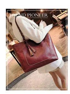 Stylish women wine red PU leather tote bag with braided shoulder strap and cute tassel charm.