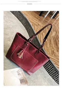 Stylish women burgundy PU leather tote bag with braided handles and front tassel pocket.