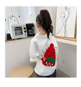 Cute strawberry canvas cross-body bag for little girls, trendy cartoon chest bag detail view.