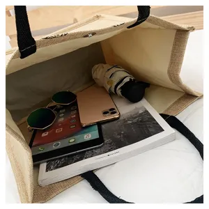 Canvas jute tote bag capacity detail showing spacious interior with daily essentials inside.