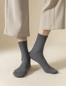Close-up detail of classic ribbed men socks in dark gray, comfortable daily wear fabric.
