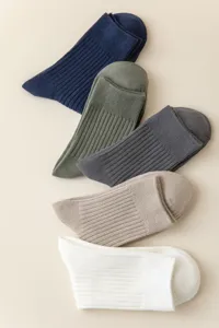 Detailed view of classic ribbed cotton men socks in assorted colors, flat lay presentation.