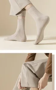 Men's solid color ribbed dress socks, comfortable cotton blend business casual crew socks.