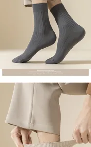 Detail shot of men's ribbed crew socks, solid color cotton knit design for daily wear.