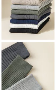 Detailed view of ribbed knit men's dress socks in assorted colors, showing fine texture.